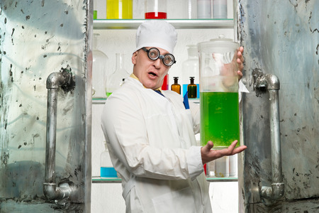 Funny chemist with a bottle in the labの写真素材