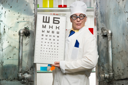 Funny oculist with a table in the laboratoryの写真素材