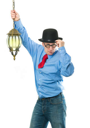 Attractive man with a lantern in his handの写真素材