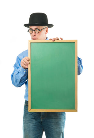 Serious man in blue shirt with a blackboardの写真素材