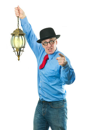 Attractive man with a lantern in his handの写真素材