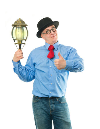 Attractive man with a lantern in his handの写真素材