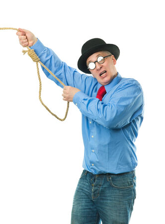 Unhappy man with a rope in his handsの写真素材