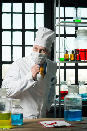 Scientist chemist puts science experiment in laboratoryの写真素材