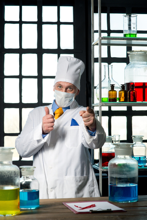 Scientist chemist puts science experiment in laboratoryの写真素材
