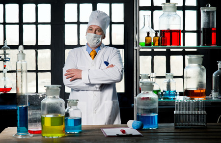 Scientist chemist puts science experiment in laboratoryの写真素材