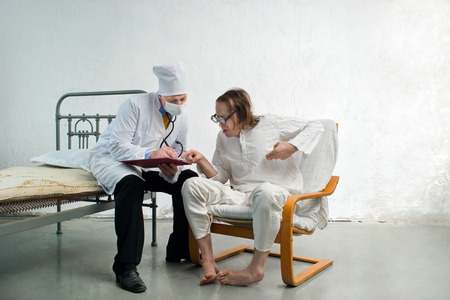 Doctor and funny patient in a hospitalの写真素材