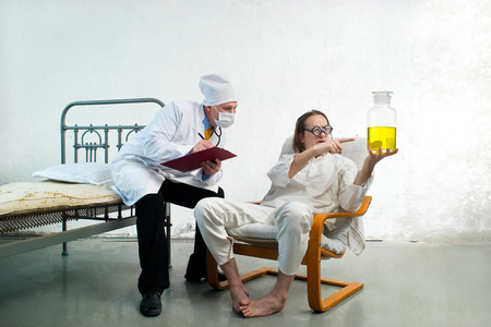 Doctor offers the patient the medicationの写真素材