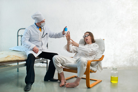 Doctor offers the patient the medicationの写真素材