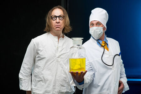 Doctor and patient holding a bottle medicineの写真素材