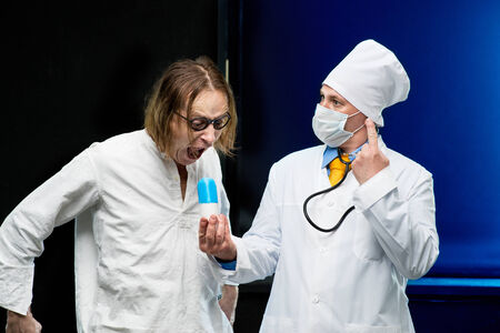 Patient takes the pill out of the hands of the doctorの写真素材