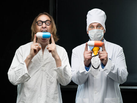 Doctor and patient with pillsの写真素材