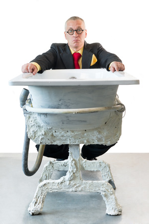 Man in suit with art bathの写真素材