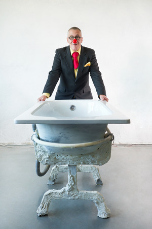 Man in suit with art bathの写真素材
