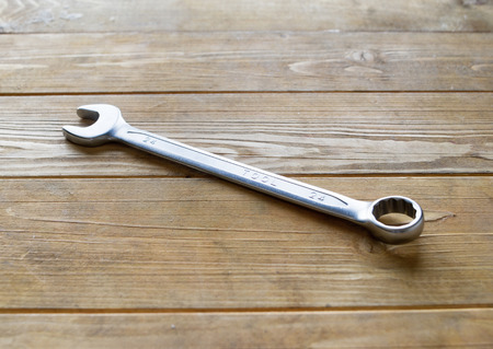 Spanner wrench on the wooden backgroundの写真素材