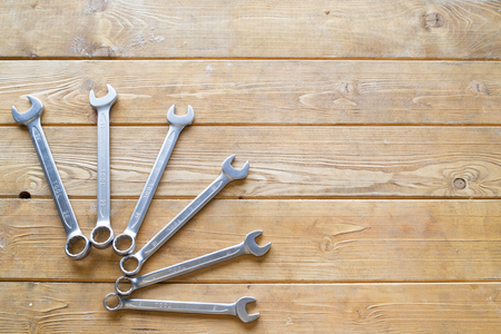 Set of wrenches on the wooden backgroundの写真素材