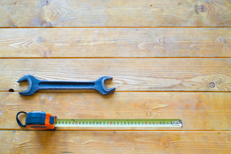 Meter and wrench on the wooden backgroundの写真素材