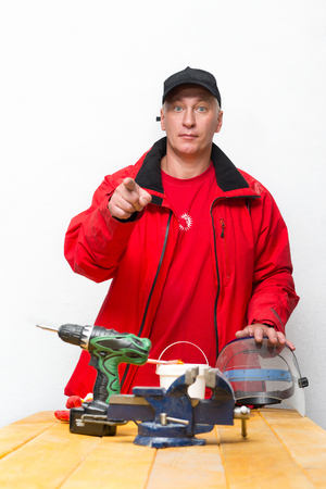 Worker with tools in the workshopの写真素材
