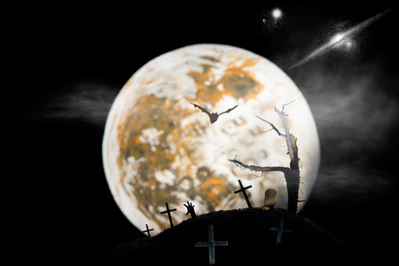 Creepy graveyard at full moonの写真素材