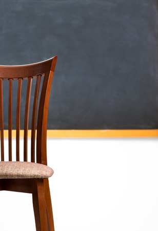 Chair on the background of the blackboard in the classroomの写真素材