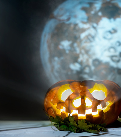Halloween pumpkins on the background of the moonの写真素材