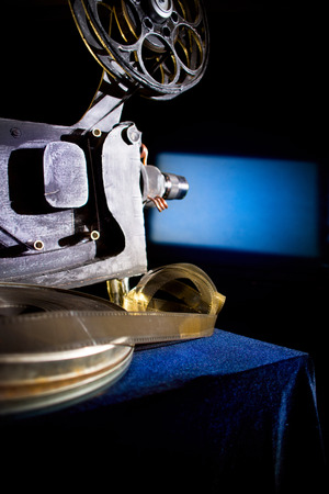 Movie projector with the film on the tableの写真素材