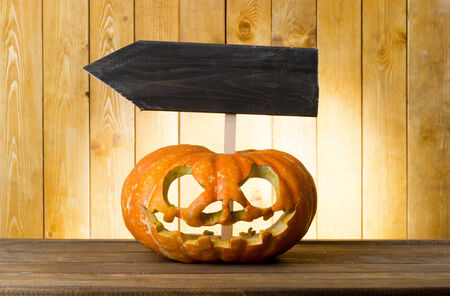 Halloween pumpkin on the wood tableの写真素材