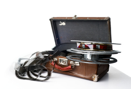 Old reel of film on a brown suitcaseの写真素材