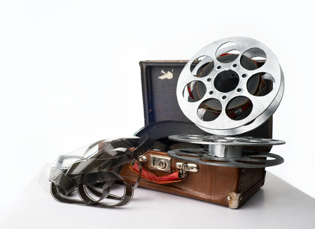 Old reel of film on a brown suitcaseの写真素材