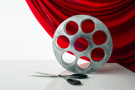 Reel of film and red curtainの写真素材