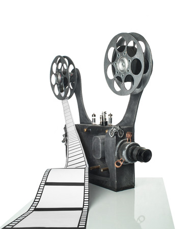 Movie projector with the film on the white backgroundの写真素材
