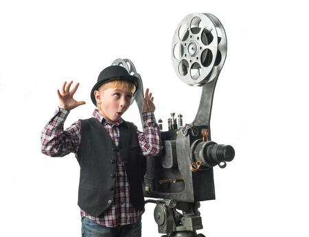 Little boy with a film projectorの写真素材