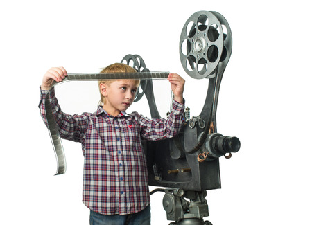 Little boy with a film projectorの写真素材