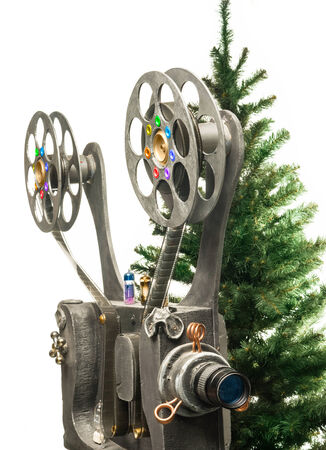 Movie projector and new years tree on a white backgroundの写真素材