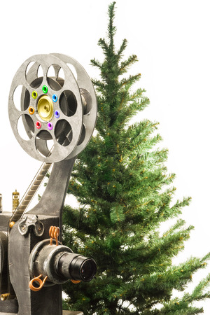 Movie projector and new years tree on a white backgroundの写真素材