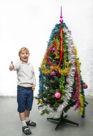 Little boy near the Christmas treeの写真素材