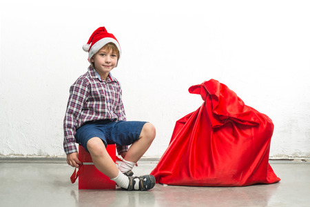 Little Santa Claus with red sackの写真素材