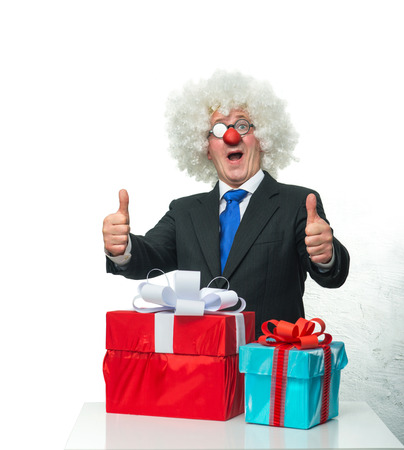 Cheerful Clown with a giftsの写真素材