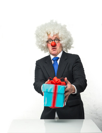 Cheerful Clown with a giftsの写真素材