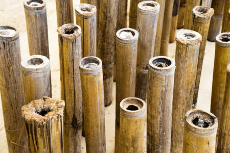 Background of bamboo sticks in the sandの写真素材