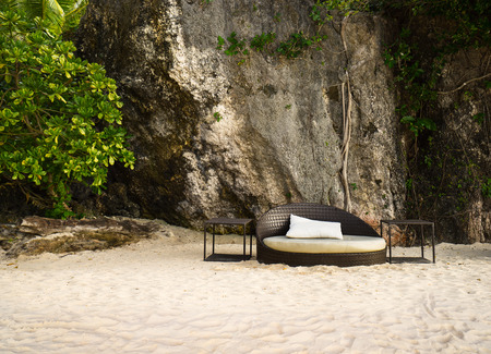 Lounger with pillow on the beach by the seaの写真素材