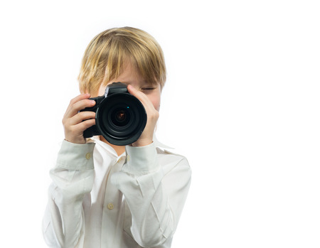 Portrait of little photographer with cameraの写真素材