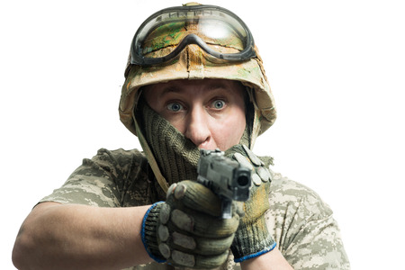 Soldier in camouflage with a gunの写真素材