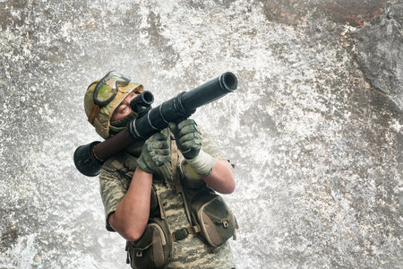 Soldier in camouflage with a weapon