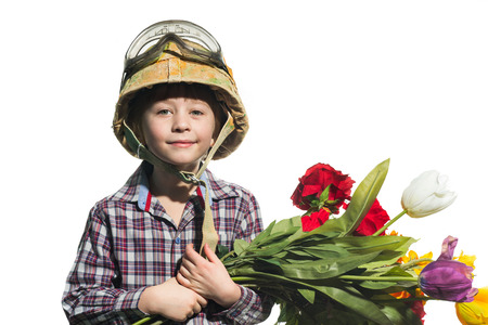 Little soldier with a bouquet of flowersの写真素材