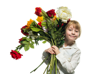 Portrait of boy with a bouquet of flowersの写真素材