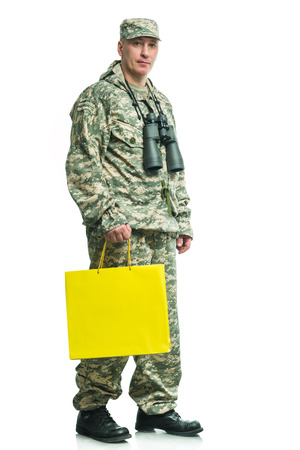 Soldier in uniform with a packageの写真素材