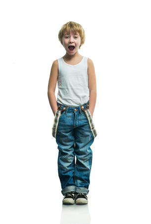 Screaming boy in jeans on the white backgroundの写真素材