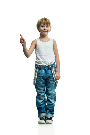 Smiling boy in jeans on the white backgroundの写真素材