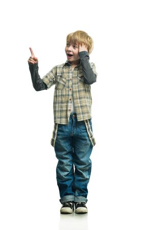 Little boy in jeans on the white backgroundの写真素材